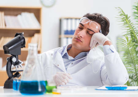 Male doctor working in the lab on virus vaccineの写真素材