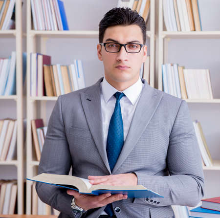 Business law student working studying in the libraryの写真素材