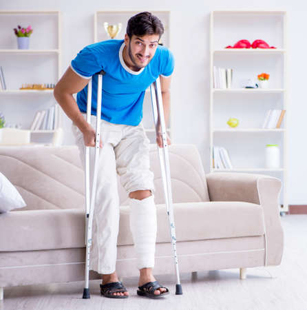 Injured young man recovering at homeの写真素材