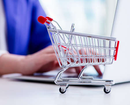 Businesswoman buying online using plastic credit card