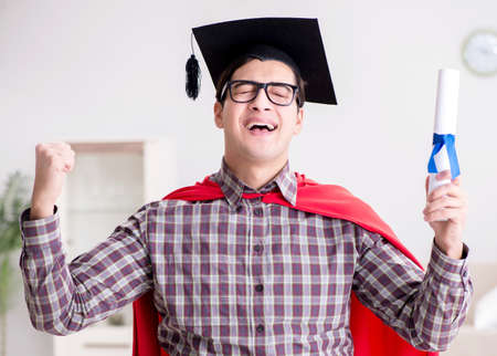 Super hero student graduating wearing mortar board capの写真素材
