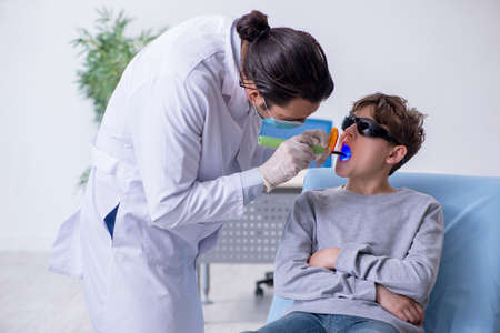Young boy visiting doctor in hospitalの写真素材