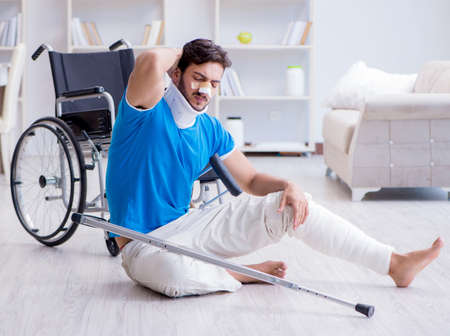 Injured young man recovering at homeの写真素材