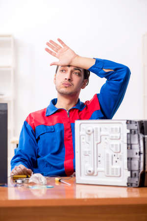 Young engineer repairing musical hi-fi systemの写真素材