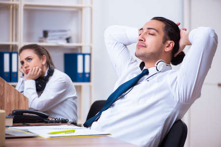 Call center operators working in the officeの写真素材