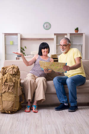 Old couple preparing for vacation travelの写真素材
