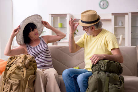 Old couple preparing for vacation travelの写真素材
