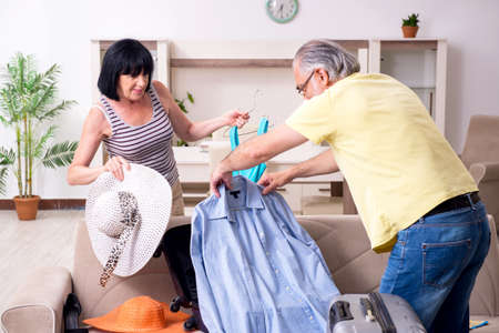 Old couple preparing for vacation travelの写真素材