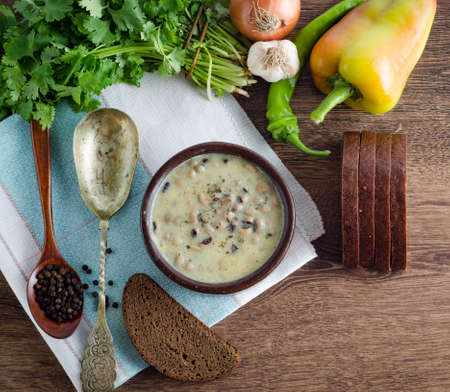 Mushroom soup served on the tableの写真素材