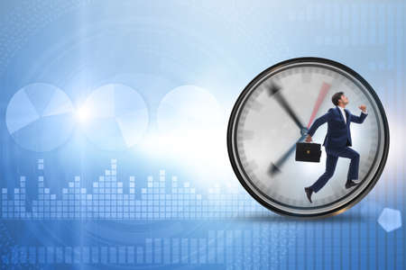 Businessman employee in time management conceptの写真素材