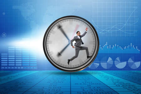 Businessman employee in time management conceptの写真素材
