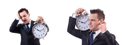 Man with alarm clock isolated on whiteの写真素材