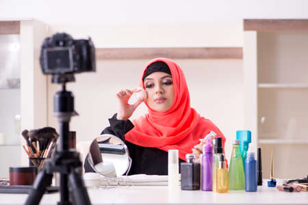 Beauty blogger in hijab recording video for her blogの写真素材