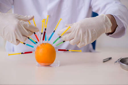 Male nutrition expert testing food products in labの写真素材