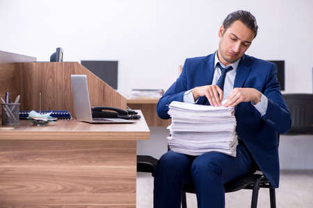 Young handsome businessman working in the officeの写真素材