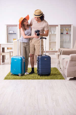 Young couple preparing for tripの写真素材