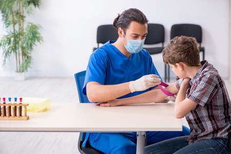 Young boy visiting doctor in hospital