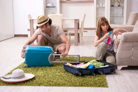 Young couple preparing for tripの写真素材