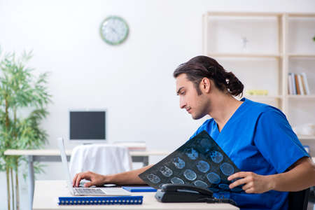 Young male doctor working in the clinic