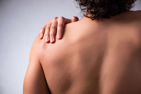 Young man suffering from upper limb pain