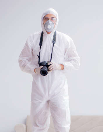 Forensic expert at crime scene doing investigationの写真素材