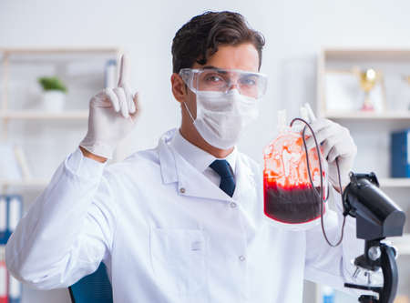 Doctor working with blood samples in hospital clinic labの写真素材