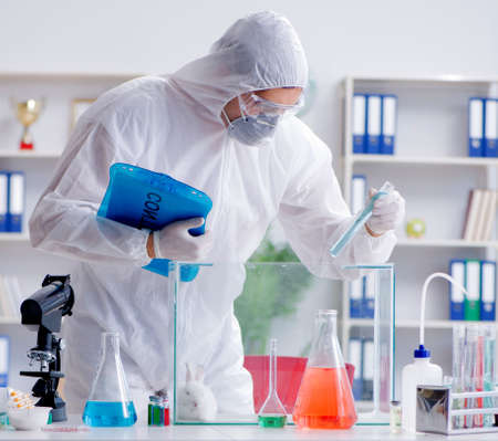 Scientist doing animal experiment in lab with rabbitの写真素材