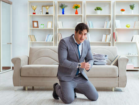 Drunk businessman celebrating in the officeの写真素材