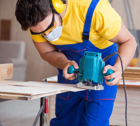 Carpenter working in the workshopの写真素材