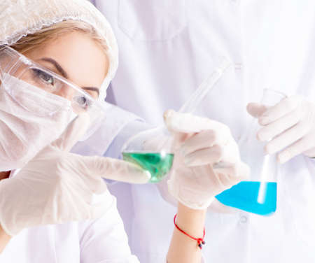 Young woman chemist working in clinic labの写真素材