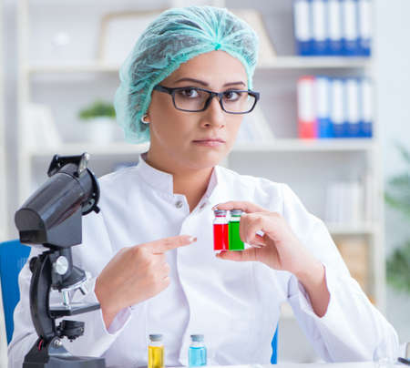 Female scientist researcher conducting an experiment in a laboraの写真素材