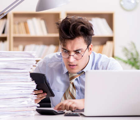 Funny accountant bookkeeper working in the officeの写真素材