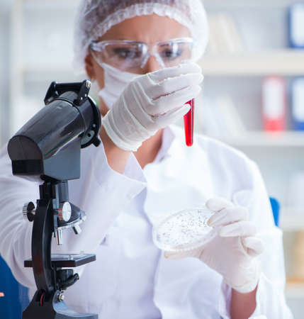Female scientist researcher conducting an experiment in a labora