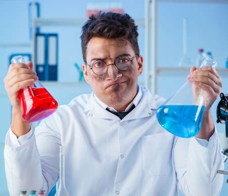 Funny mad chemist working in a laboratory