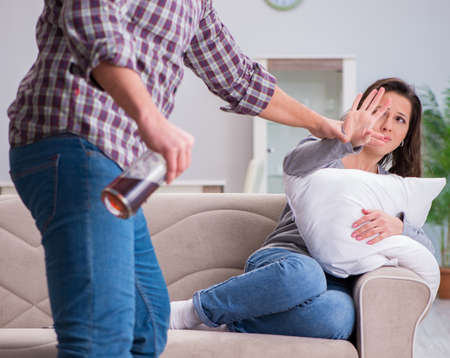 Domestic violence concept in a family argument with drunk alcohoの写真素材