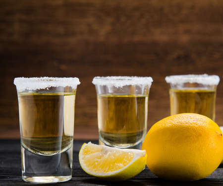 Tequila drink served in glasses with lime and saltの写真素材