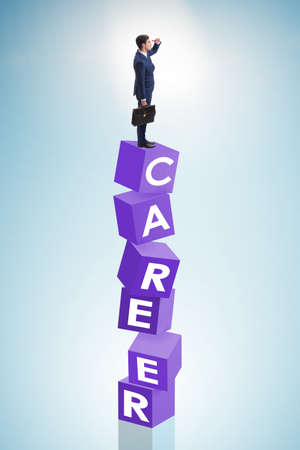 Career concept with businessman on top of blocksの写真素材