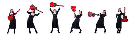 Nun playing guitar isolated on whiteの写真素材