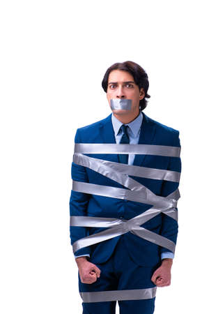 Tied employee with tape on mouth isolated on whiteの写真素材