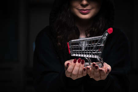 Female hacker hacking security firewall late in officeの写真素材