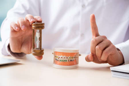 Male doctor stomatologist working in the clinicの写真素材