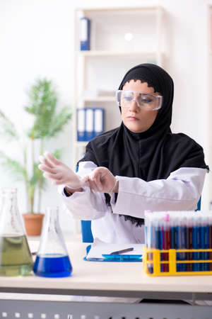 Female chemist in hijab working in the labの写真素材