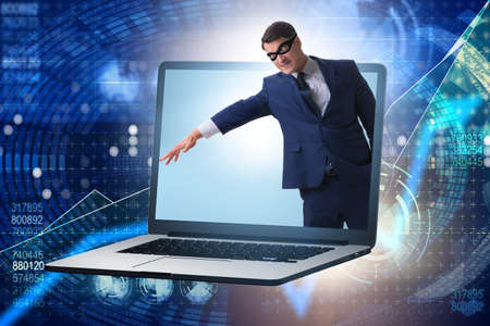 Hacker man trying to steal personal dataの写真素材