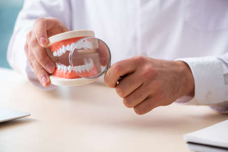 Male doctor stomatologist working in the clinic