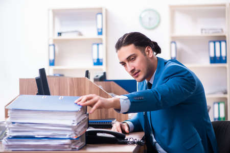 Young handsome businessman sitting in the officeの写真素材