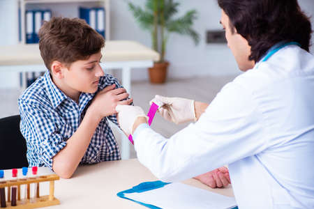 Boy in blood tranfusion conceptの写真素材