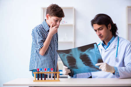 Male radiologist looking at boys images