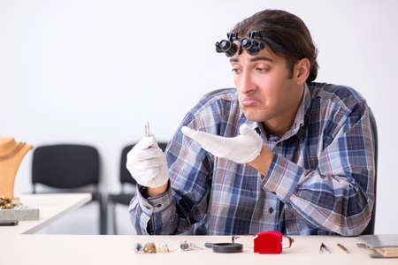 Young male jeweler at workshop