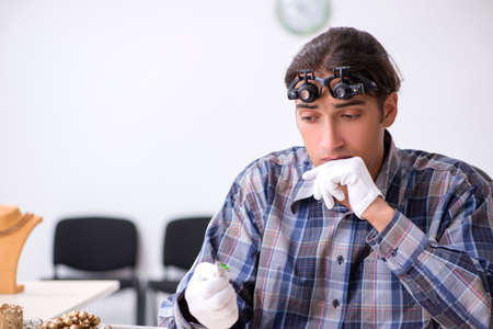 Young male jeweler at workshop