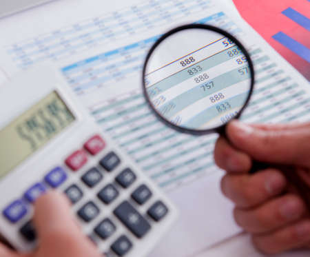 Finance analyst looking and financial reports
